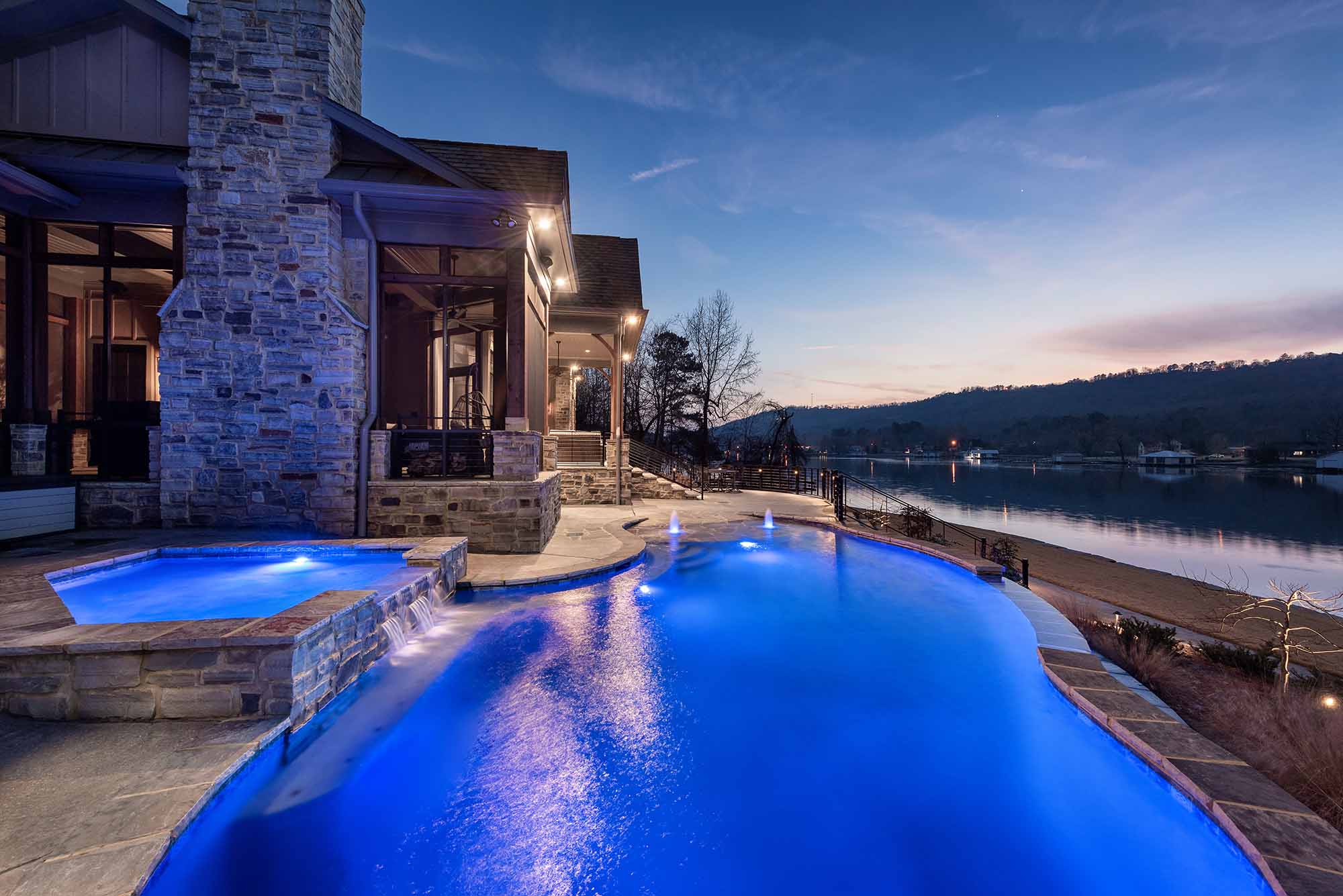 House with swimming pool at night blue lights
