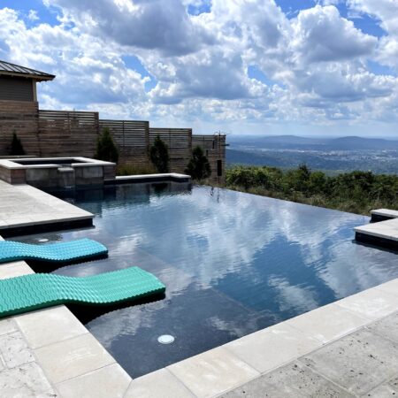 Geometric infinity pool with built in tanning ledges