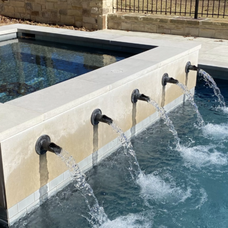 a spa with fountains into pool