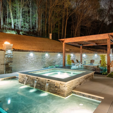 a square pool at night with led pool lighting