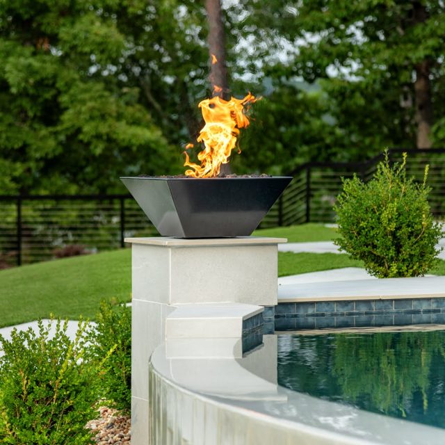fire feature next to swimming pool